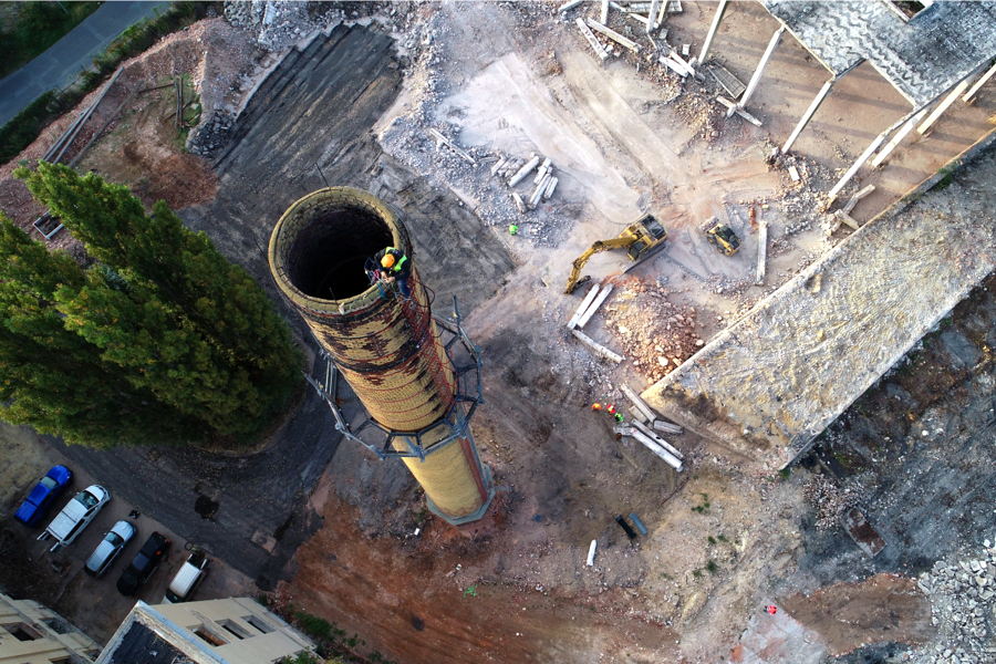 A chimney being prepared for demolition
