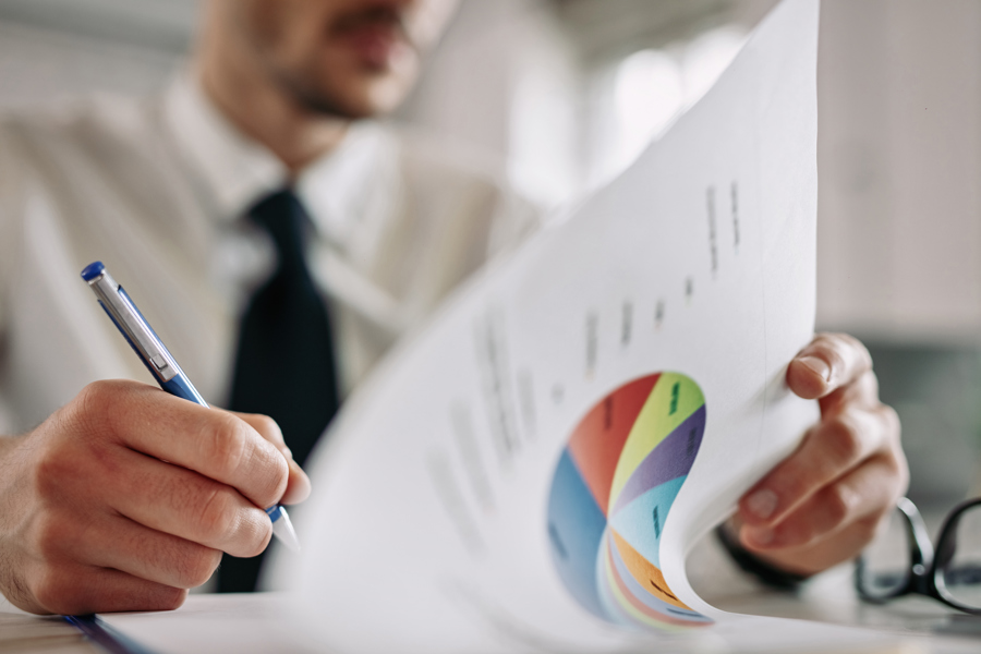 man recording data into a document